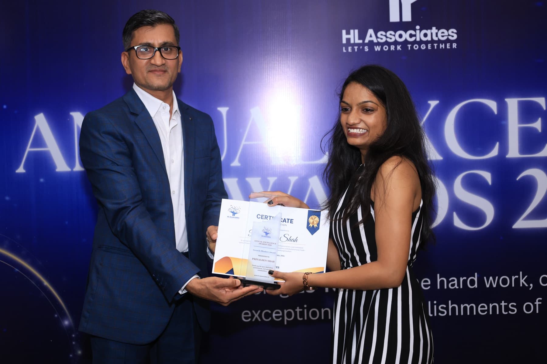 A team member receiving a certificate at the team trip awards