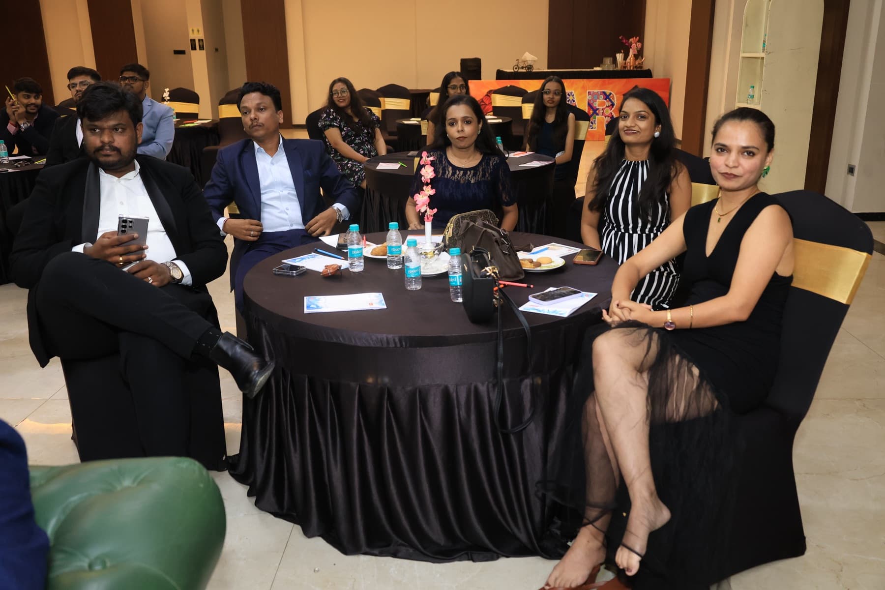Team members at a table during the team trip awards evening