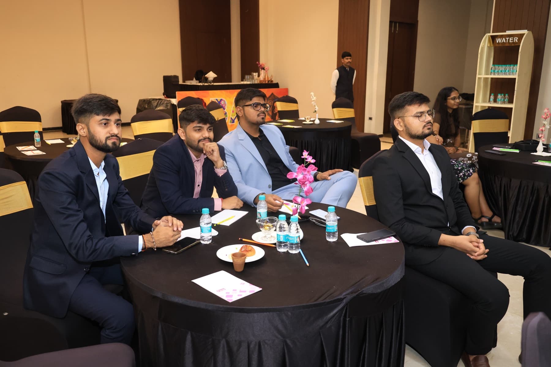 Team members at a table during the team trip awards evening