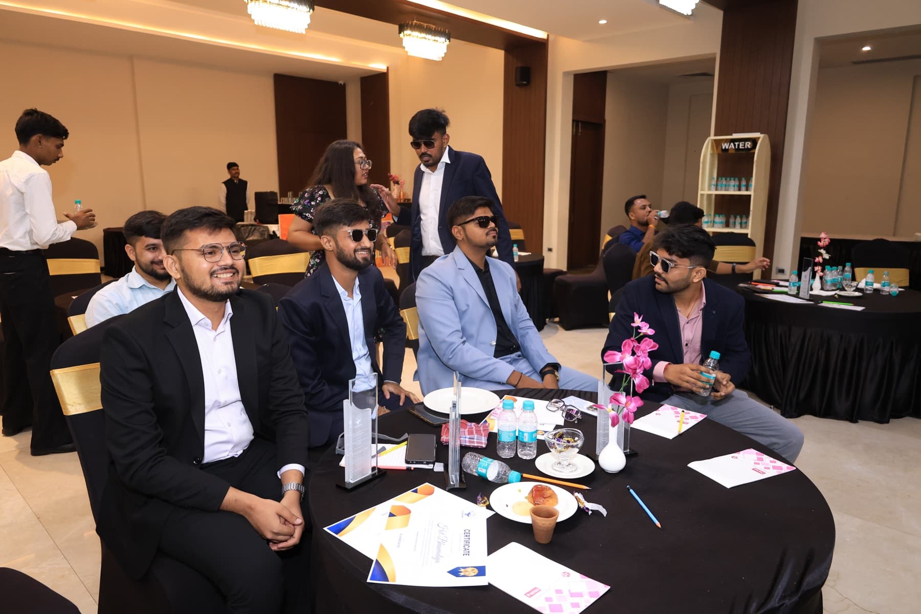 Team members at a table during the team trip awards evening