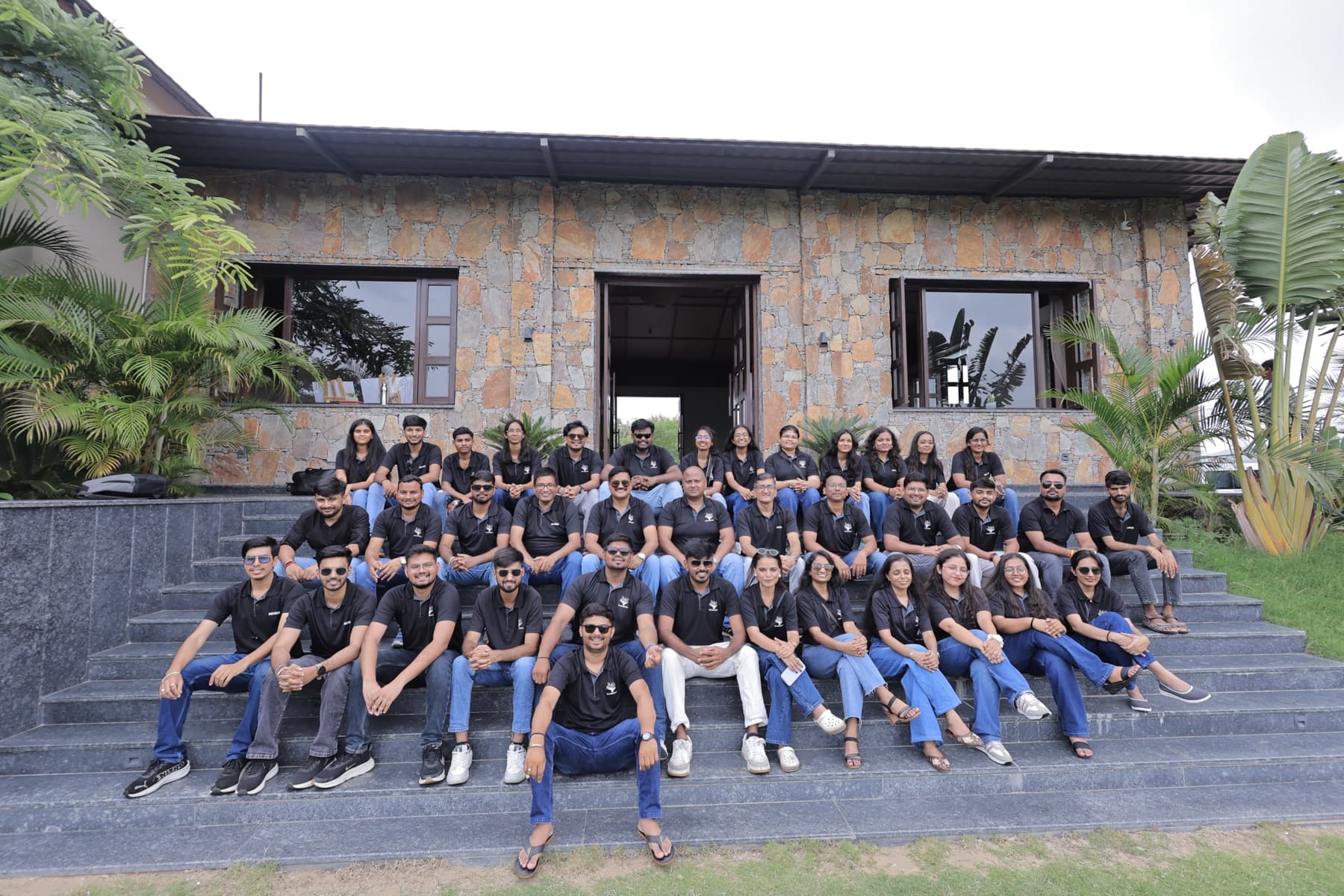 The MedReg team in company polo shirts, seated together