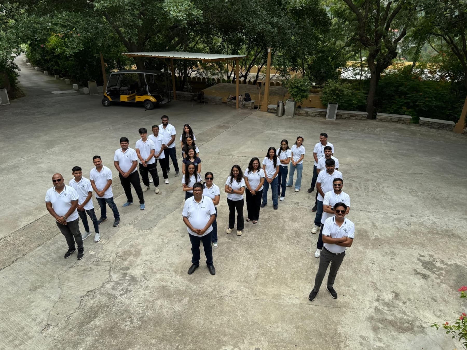 Aerial view of the MedReg team standing in the shape of the MedReg logo